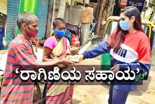 Actress Ragini distributing food to needy