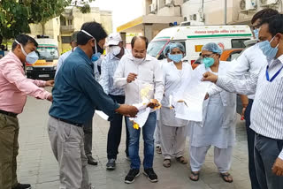 Health workers protested by burning a copy of the GO