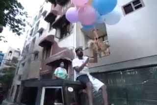 dog flying tied in balloon