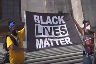 Crowd demands justice in Black man's police death