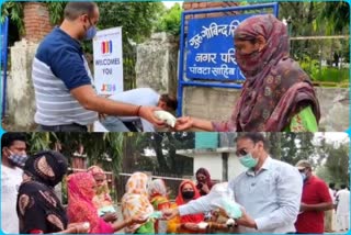 Rotary Club distributed milk packets and masks to the cleaning staff of the City Council Paonta Sahib