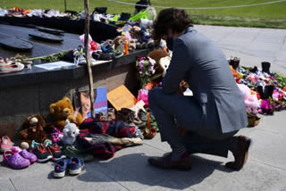 Canadian Prime Minister Justin Trudeau visits a memorial at the Eternal Flame on Parliament Hill in Ottawa on Tuesday,