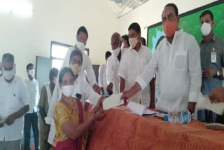 cheques distribution in nirmal district