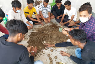 youth is making seed bomb in Dhanrua