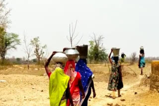 Gurcharwa Villagers bring water from one kilometer away