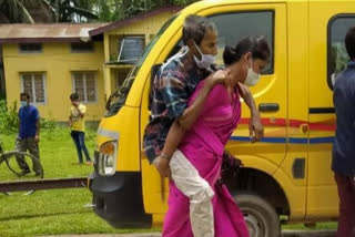 assam-woman-niharika-das-carries-covid-positive-father-in-law-on-shoulders