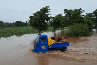 People crossing bridge with their lives on their palms