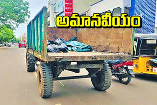 Moving dead bodies in a municipal tractor at Kakinada