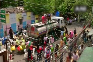 locals climb on the water tanker