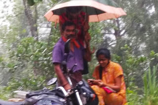 Man holds umbrella to help daughter attend online class on roadside in Karnataka