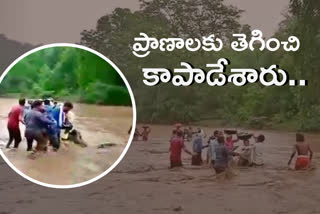 youth-saved-labours-from-flood-in-chintakarra-vagu-at-komaram-bheem-district