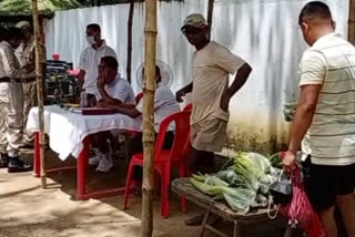 assam-police-personnel-are-providing-vegetables-at-affordable-prices-to-the-locals-at-barhampur