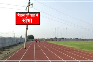 electric pole between racing track in panipat stadium