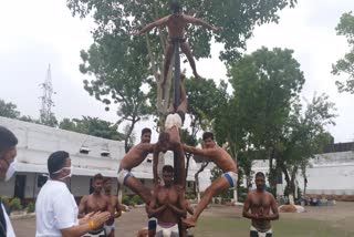 Prisoners doing mallakhambaYoga