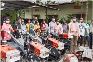 Minister Rameshwar Teli distributes power tiller and loom