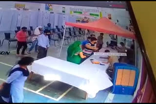 cctv footage of civil defense personnel beating at vaccination center