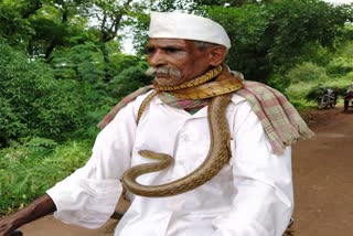 old man ride bicycle snake Hangarga