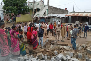 గ్రామస్థుల ఫిర్యాదుతో ప్రార్థన మందిరం ప్రహారి కూల్చివేత