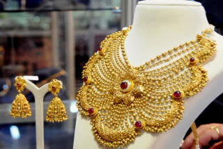 Gold price dipped marginally to Rs 46,903 per 10 gram