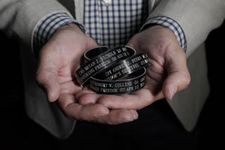 U.S. Army veteran with servicemen bracelets