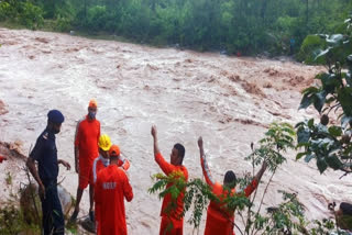 NDRF personnel conduct search and rescue operations.