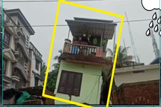 Two-storied house tilts in heavy rains, gets stuck on the adjacent house