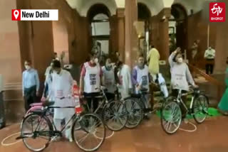 Trinamool MPs cycle to Parliament to protest fuel price hike