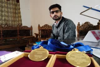 kashmir university topper peerzada dawar got two gold medal