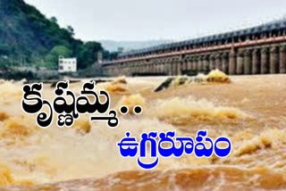 heavy flow of flood water at  prakasham barrage