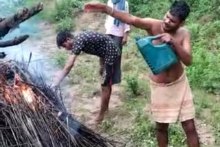 Relatives setting pyre on fire by pouring kerosene