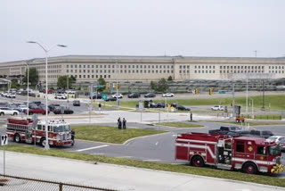 Emergency vehicles are seen outside the Pentagon Metro area Tuesday