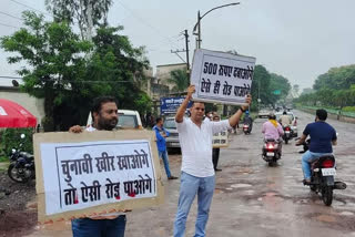 protest by holding placards and singing