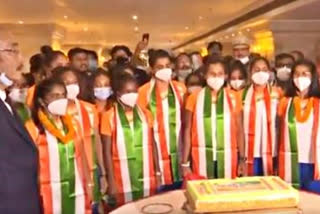 Indian Women hockey team cut a cake and sing the National Anthem as Hockey India return to the country