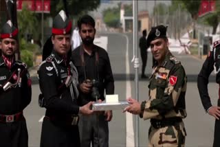 Pakistan Rangers and BSF exchange sweets at Wagah border
