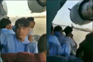 Afghan Men Hang Onto Planes Taking Off