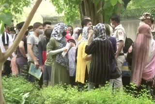 Afghan nationals gather outside Australian Embassy in New Delhi