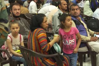 People wait for their RTPCR tests at Hindon Air Force Station Ghaziaba