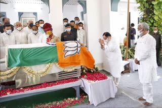 placing party flag over Indian flag at Kalyan Singh's prayer meet
