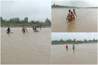 villagers-of-sri-lanka-tapu-crossing-gaula-river-at-h