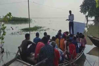 Students study on makeshift school on boat in flood hit Bihar