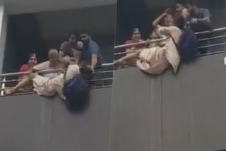 பெல்காம், கர்நாடகா, Family members tried to push down a man from the building