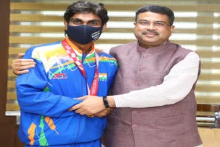 Union minister Dharmendra pradhan meet para-shuttler and gold medal pramod bhagat at Delhi