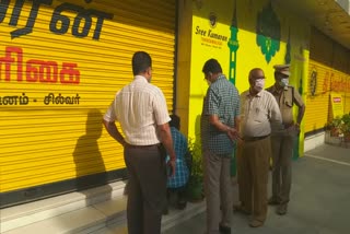 Corporation officials sealed Chennai Silks for shop opens in violation of ban