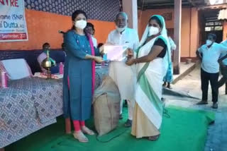 Ceremonial distribution of food grains to Anganwadi centre