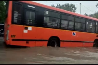 Buses stuck amid waterlogged roads following heavy rains in the National Captial delhi