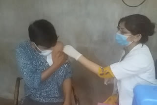 giving vaccination