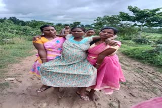 pregnant woman carried on shoulder in chaibasa