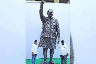 Statue of Prime Minister Modi by automobile scrap