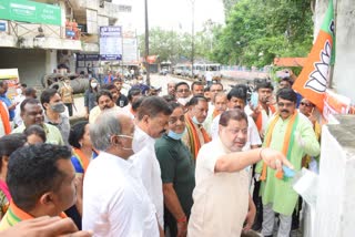 BJP workers painting the walls