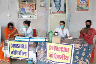 people getting vaccine at center